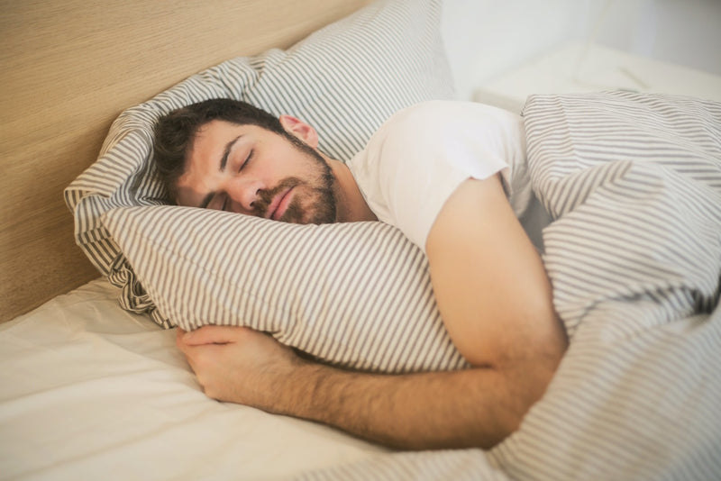 Man experiencing better sleep after taking magnesium